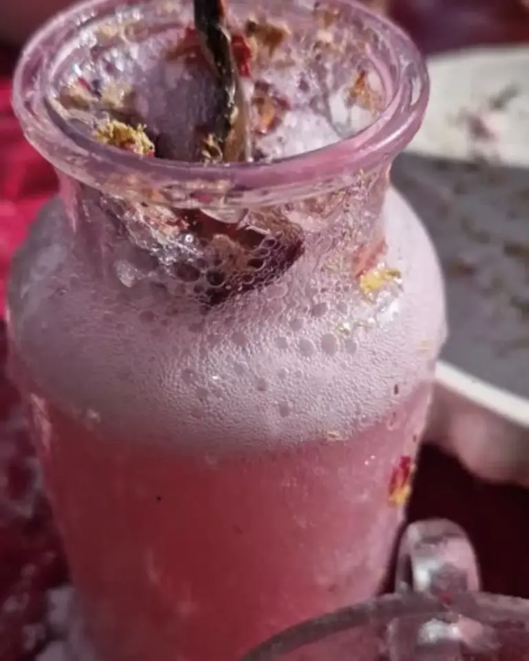 Bubbling pink Faerie Secrets potion in a jar with florals and sparkles — fizzing magical activity for children by Sparkle & Spell Co.