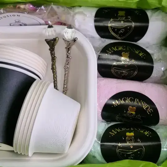 Floral infusion mix and potion powders from the Sorcerer’s Spellbook Magic Potion Kit by Sparkle & Spell Co., designed for creative potion play.